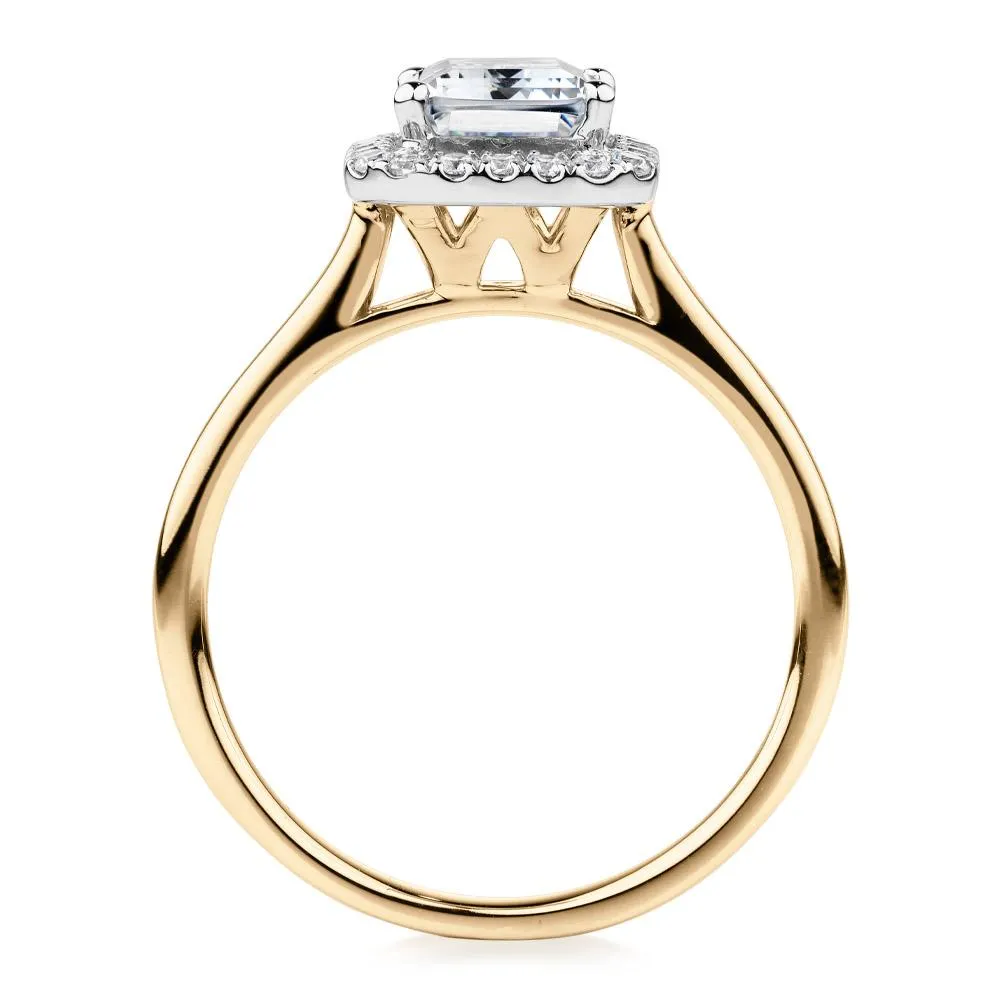 Emerald Cut and Round Brilliant halo engagement ring with 1.92 carats* of diamond simulants in 14 carat yellow and white gold