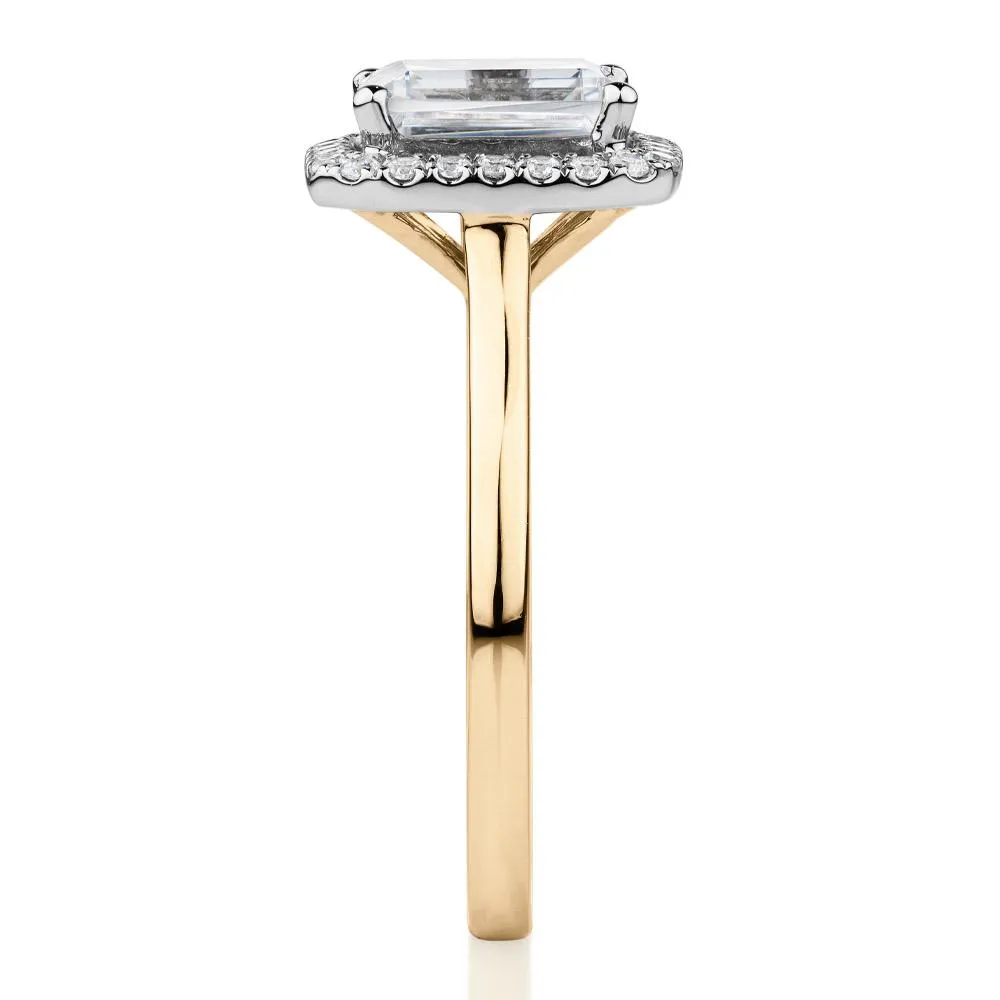 Emerald Cut and Round Brilliant halo engagement ring with 1.92 carats* of diamond simulants in 14 carat yellow and white gold