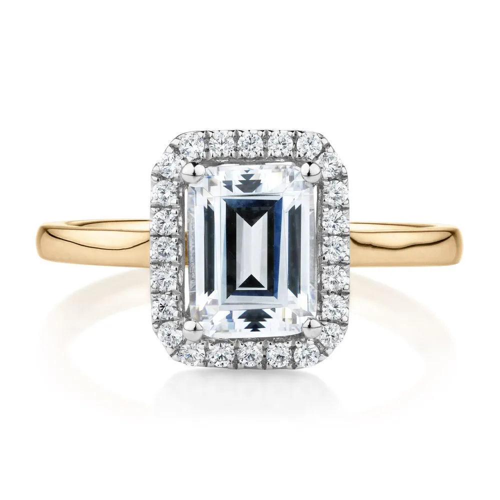 Emerald Cut and Round Brilliant halo engagement ring with 1.92 carats* of diamond simulants in 14 carat yellow and white gold